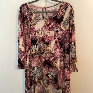 Cato. Size 18/20. Soft knit top. Black, purple and gold print.